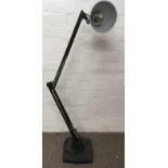 An floorstanding Anglepoise lamp on heavy base wit