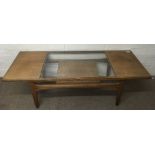 A rectangular glass topped coffee table with undershelf.Approx 50x1.37m