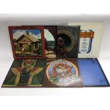 Twelve Grateful Dead and related LPs and 12 inch s