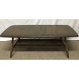 An Ercol dark wood coffee table with undershelf.Ap