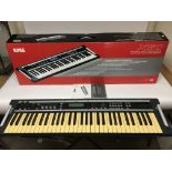 A Korg X50 synthesizer keyboard in retail box with