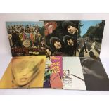 A collection of Beatles and Rolling Stones LPs (7).