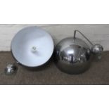 A pair of retro chrome dome shaped lights, a/f.Approx 32cm diameter.