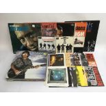 A collection of LPs, 7 inch singles and EPs by various artists including The Beatles, Prince, OMD
