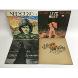 Four Neil Young LPs comprising 'Harvest', 'After T
