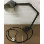 A metal industrial lamp with adjustable arm