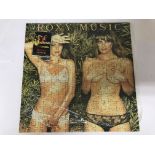 A Jigstars 250 piece jigsaw puzzle of Roxy Musics, 'Country Life' (1974) album cover. Size approx