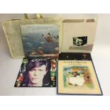 A box and a bag of various LPs including Cat Stevens, Steely Dan etc.