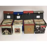 Four record boxes containing approx 200 7 inch sin