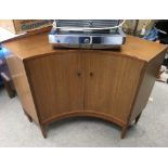 A Greaves and Thomas retro curved corner cupboard