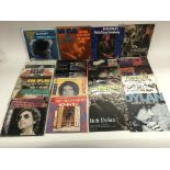 A collection of Bob Dylan 7 inch singles in pictur