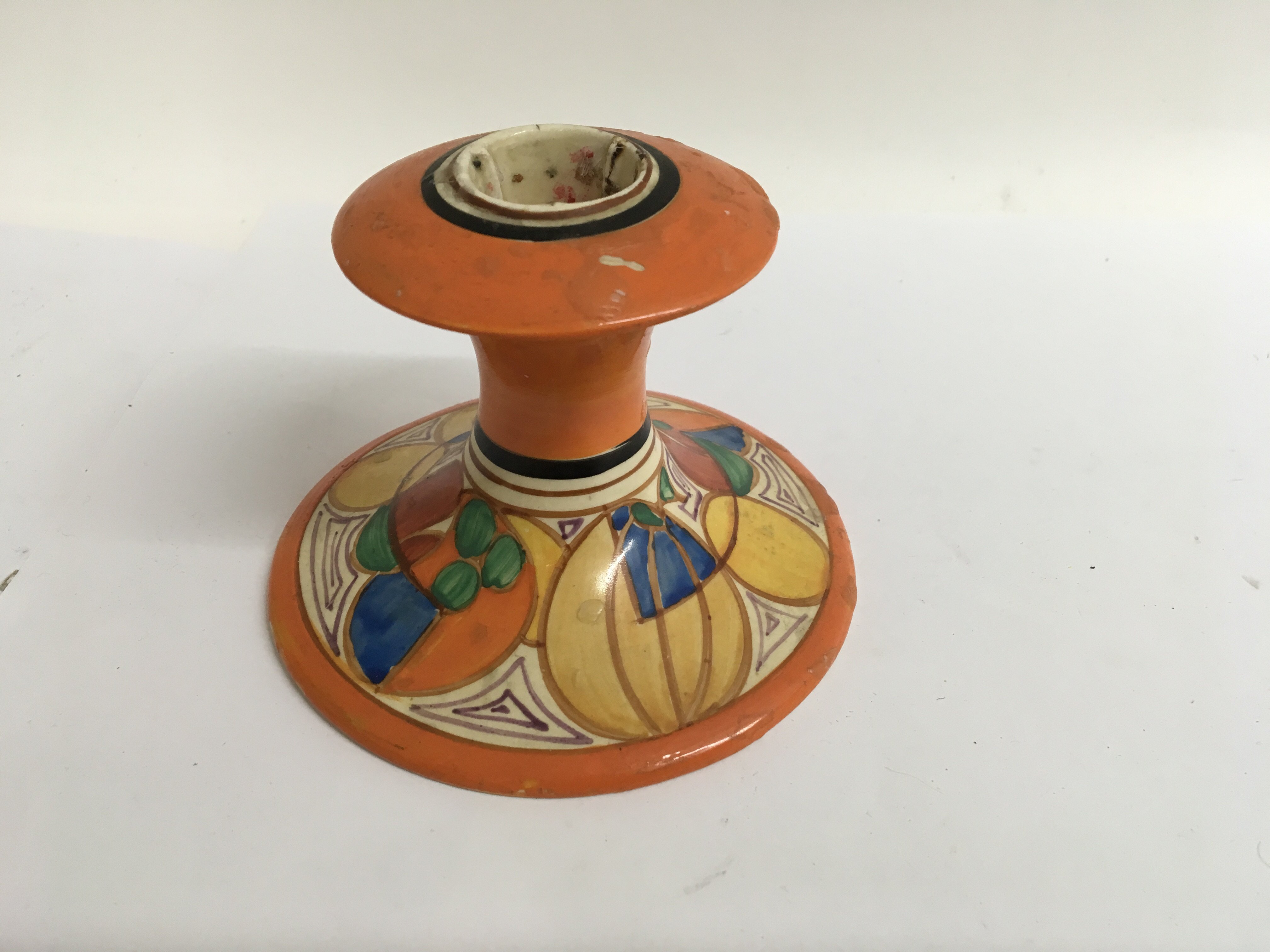 A Clarice cliff candle stick decorated in the melon pattern, no damage or restoration 7 cm