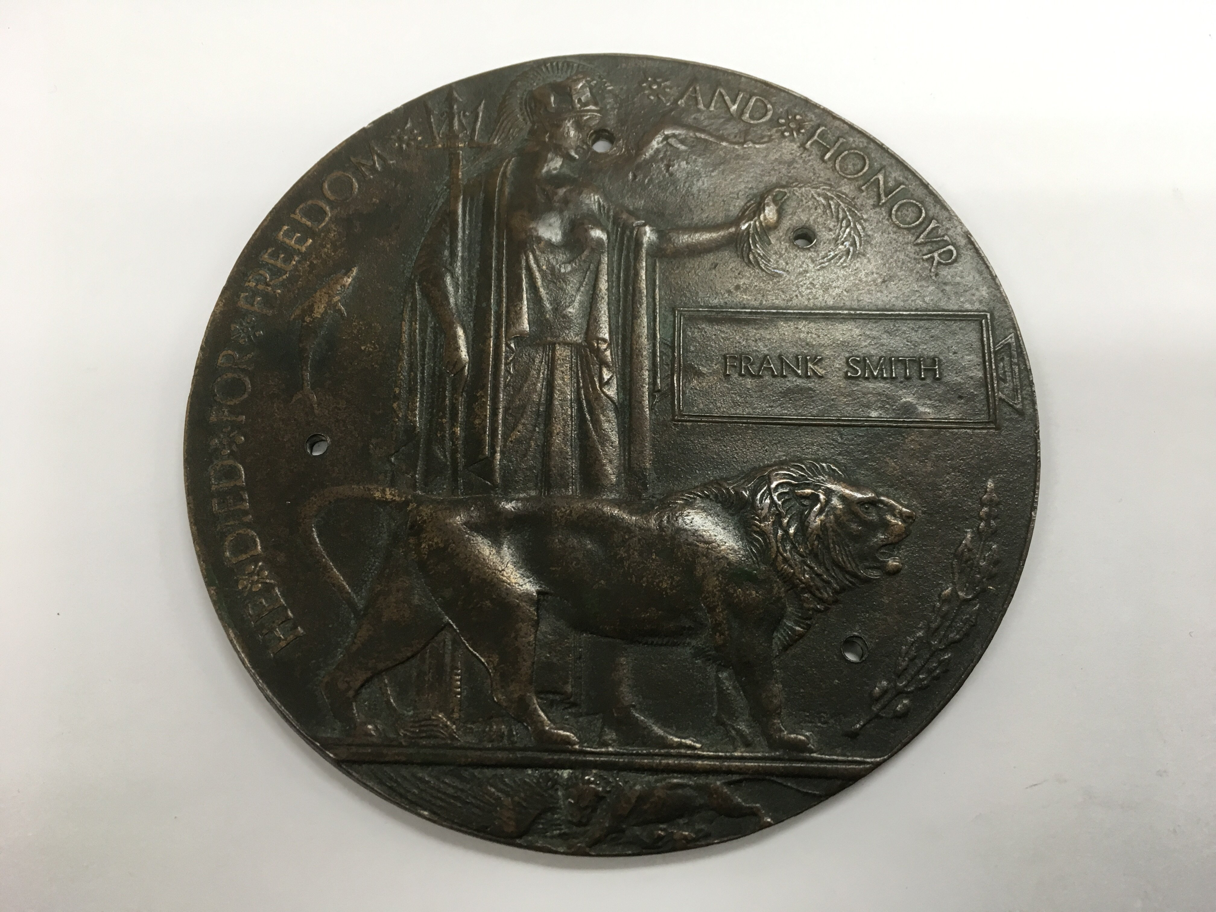 A WW1 death plaque commemorating Frank Smith, CWGR