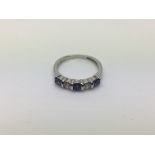 An 18ct white gold, diamond and sapphire ring with