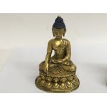 A gilt 18 th century well detailed bronze Buddha,