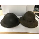 A pair of British WW2 helmets both with headliner