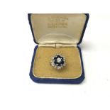 A sapphire and diamond ring. Weight approx 6.8g, s