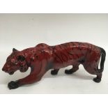 A Royal Doulton flambé tiger. Approx 33cm long