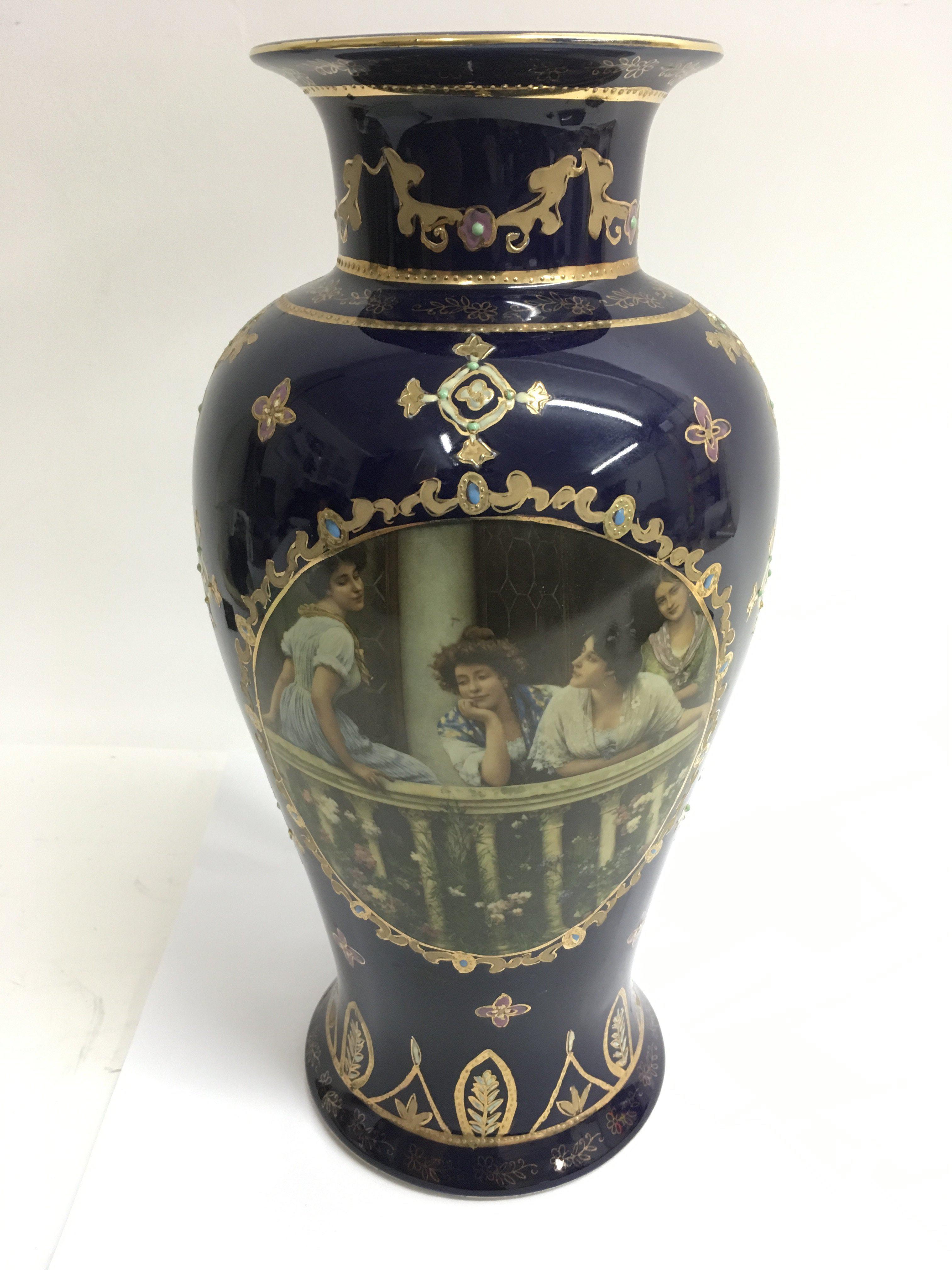 A large Limoges vase, the blue ground printed with