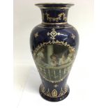 A large Limoges vase, the blue ground printed with
