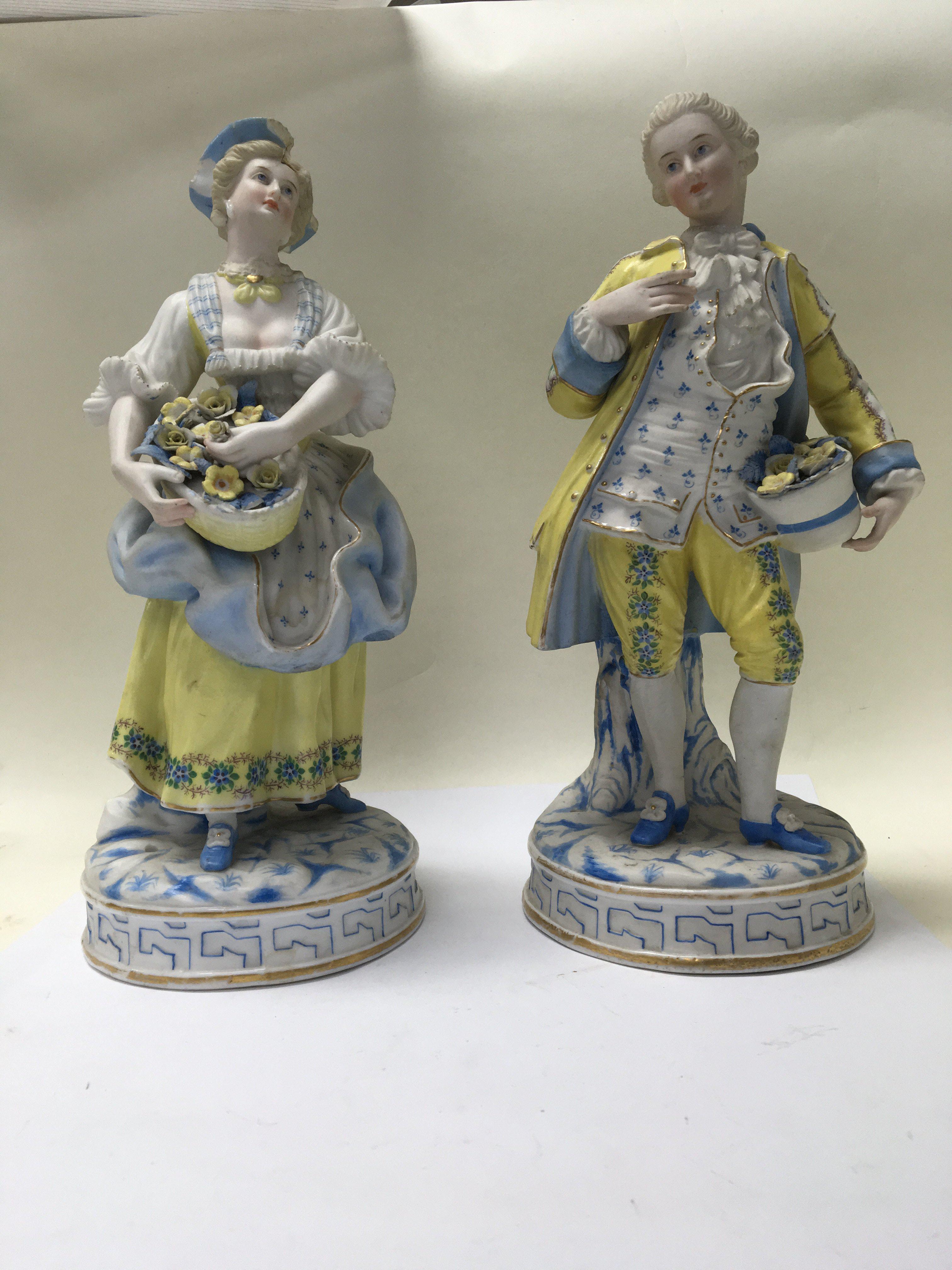 A pair of French bisque figures depicting a couple