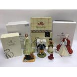 A collection of boxed Royal Doulton figures.