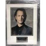 A framed and glazed photograph of Tom Hanks with a