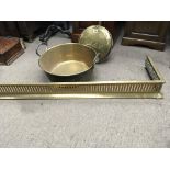 A brass preserve pan a brass fender and a brass be