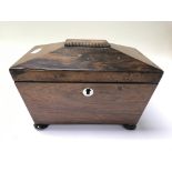 A 19th century rosewood tea caddy.