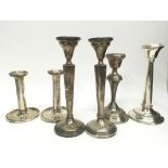 A collection of six silver candle sticks, includin