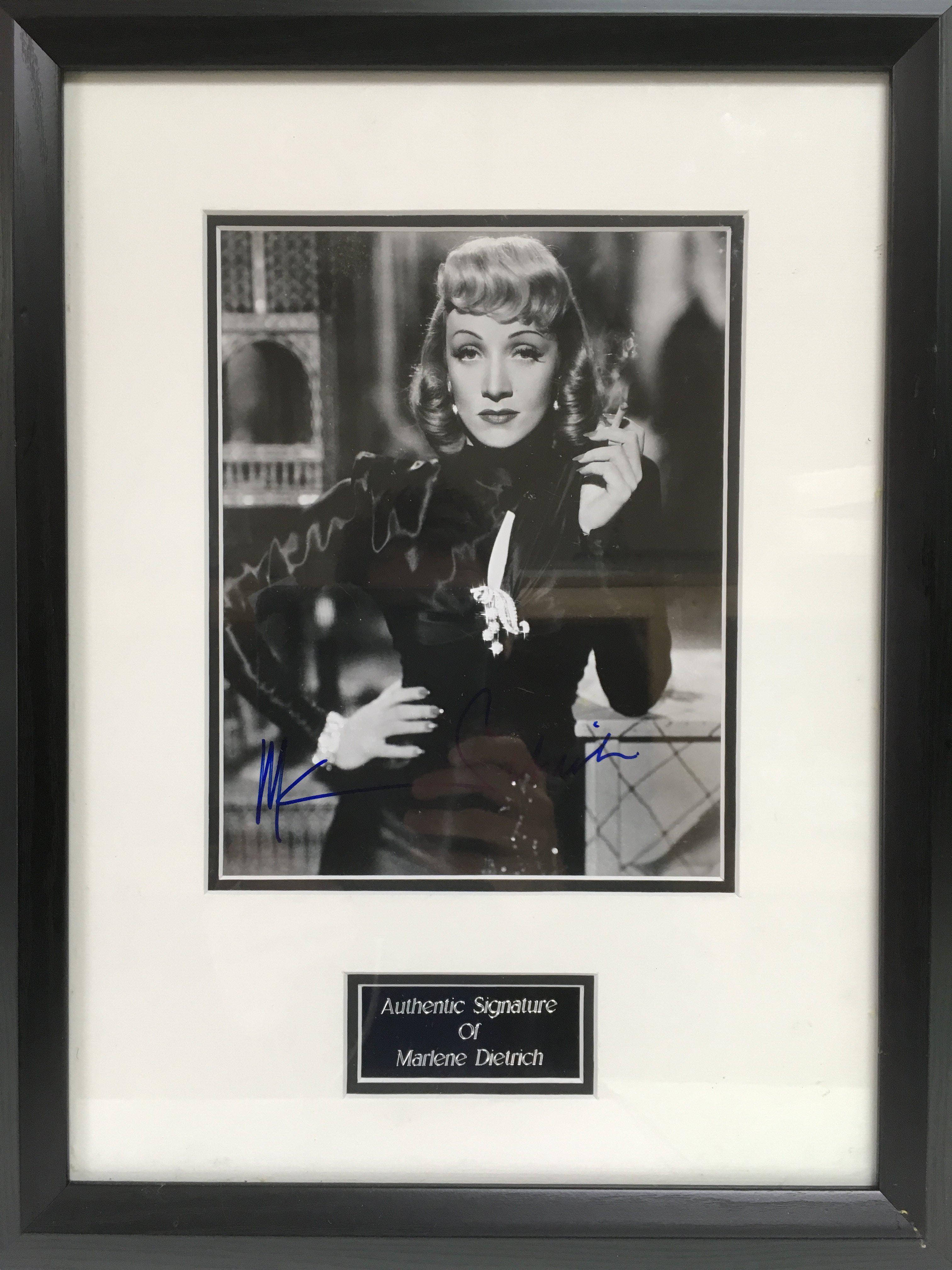 A framed and glazed photograph of Marlene Dietrich