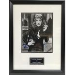 A framed and glazed photograph of Marlene Dietrich