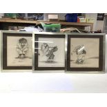 Three framed and glazed golf related sketch style