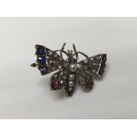 A Edwardian brooch in the form of a butterfly inse