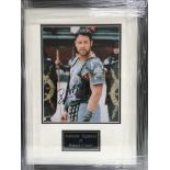 A framed and glazed photograph of Russell Crowe wi