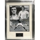 A framed and glazed photograph of Bill Foulkes wit