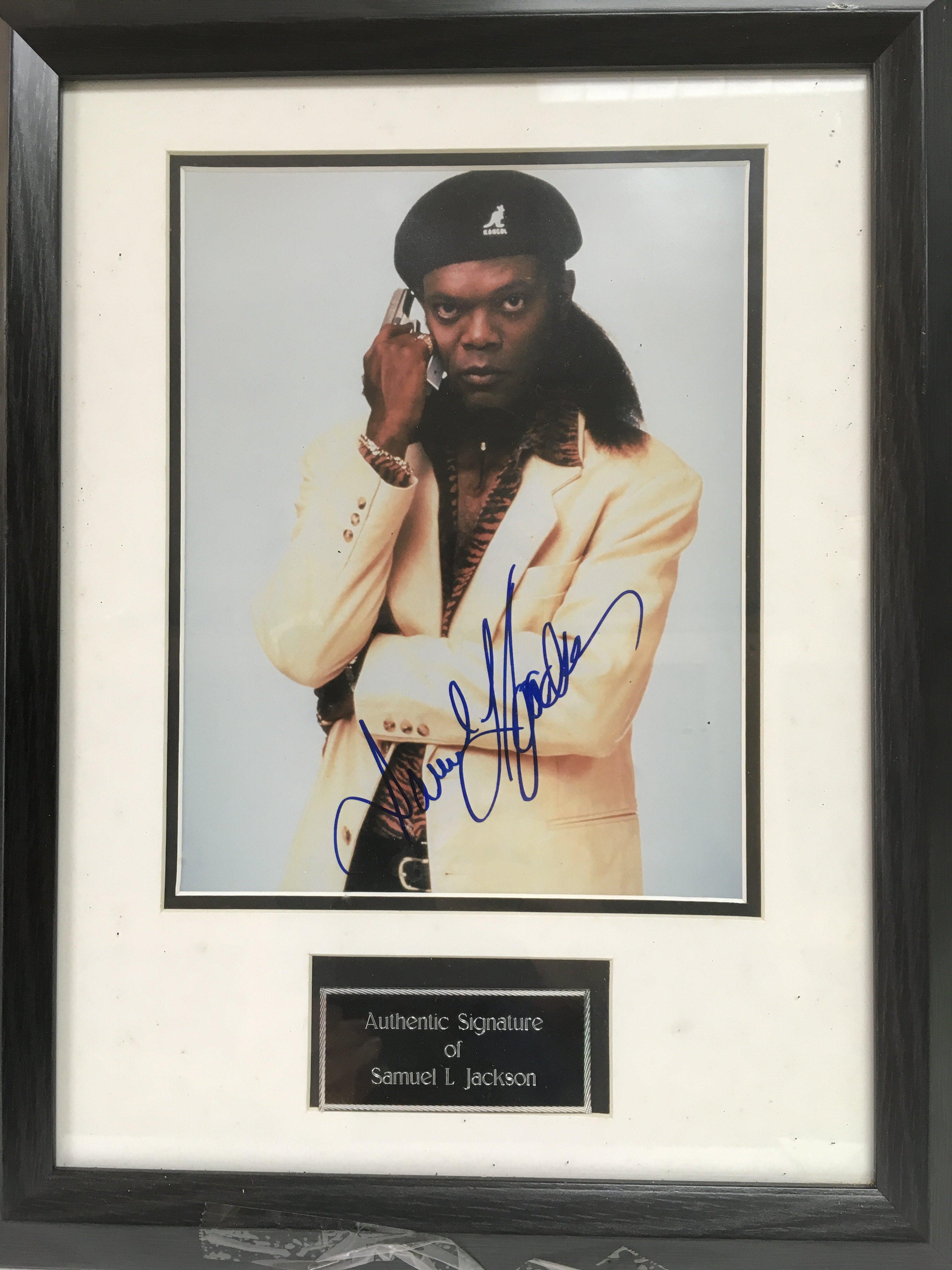 A framed and glazed photograph of Samuel L Jackson