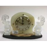 An Art Deco mantle clock with Sabino glass type si