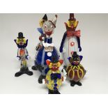 A collection of Murano clown figures including a b