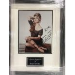 A framed and glazed photograph of Brigitte Bardot