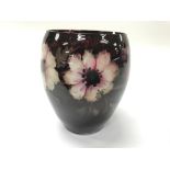 A small hand painted glass vase.