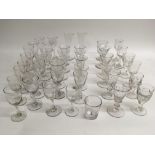 A collection of antique drinking glasses including