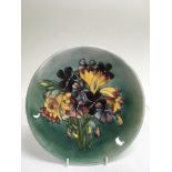 A Walter Moorcroft 'Spring Flowers' pattern plate,