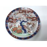 An Imari dish together with a blue and white dish.