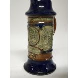 A Royal Doulton stone ware jug decorated with a portrait of Lord Nelson, and with inscription and