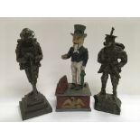 A reproduction novelty money bank and two figures of WW1 British soldiers (3).