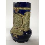 A Royal Doulton stone ware Jug dipicting Lord Nelson with battle scenes from Trafalgar. Height 20cm.