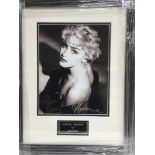 A framed and glazed photograph of Madonna with att