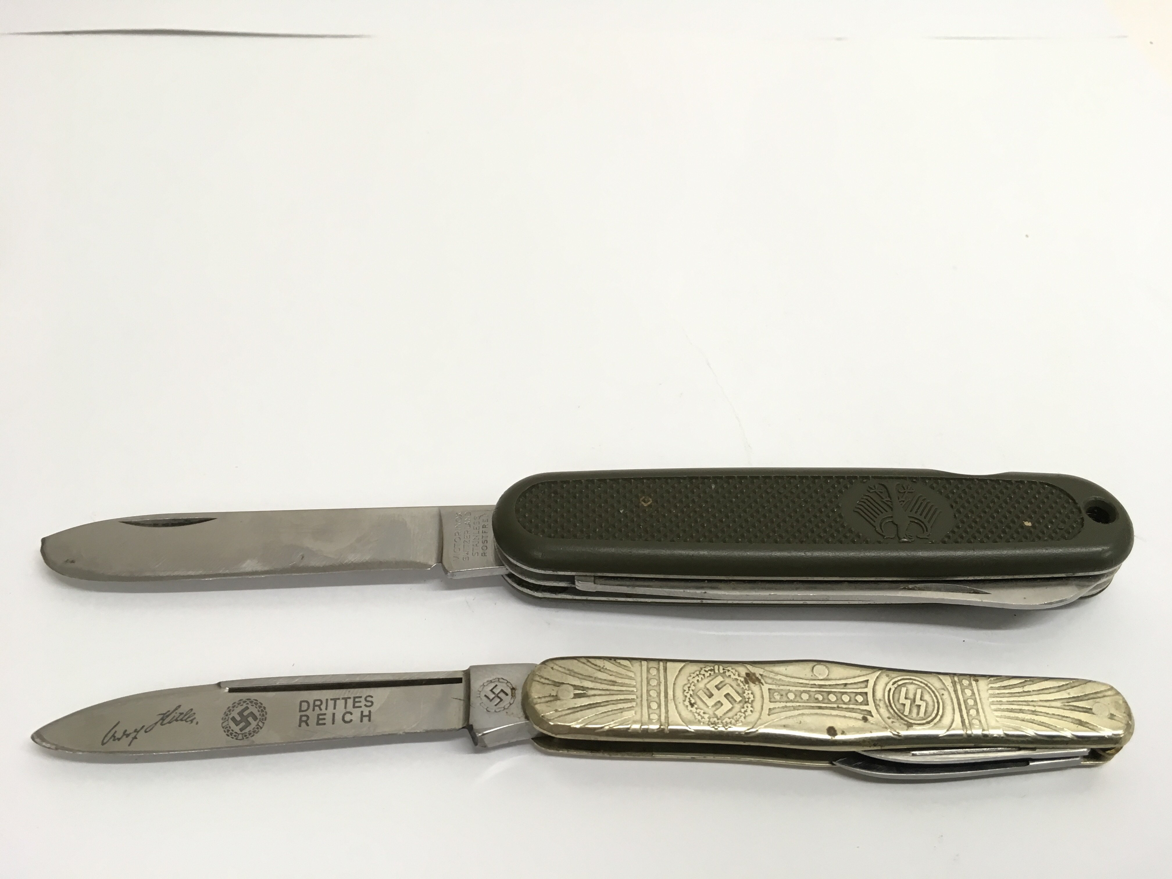 Two retrospective German Third Reich penknives, on