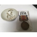 A Japanese 1939 China Incident medal and a porcela